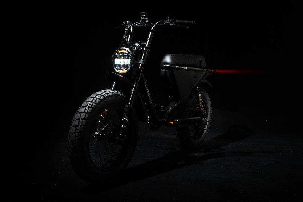 Black DiroDi Rover Pro electric bike photographed against a dark studio background